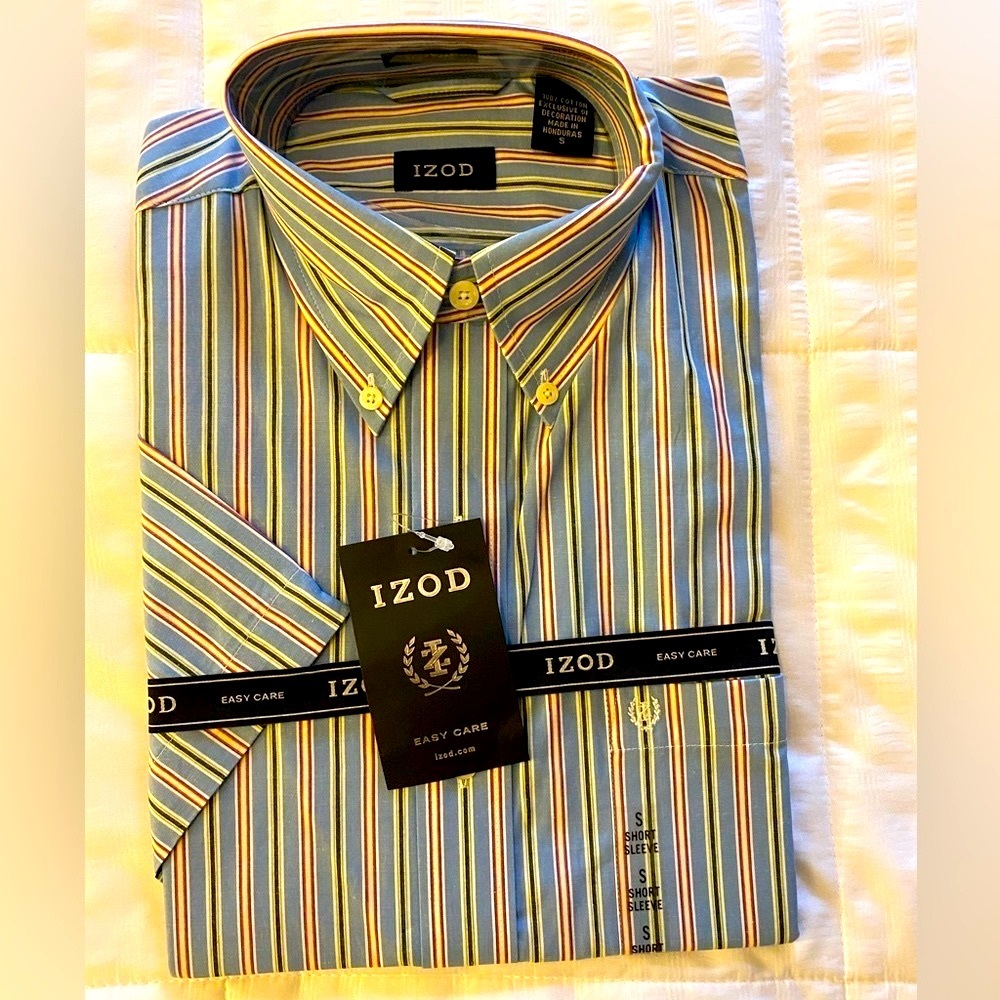 Never been opened. New Izod short sleeve with tags and logo ribbons. Size Small